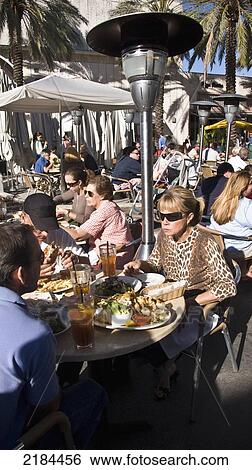 Stock Photograph - Usa, Florida, People In Outdoor Cafeteria; Miami. Fotosearch
