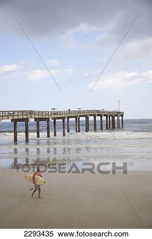 Usa, Florida, Surfer On Empty Beach; St Augustine View Large Photo Image Stock Photography - Usa, Florida, Surfer On Empty Beach; St Augustine. Fotosearch