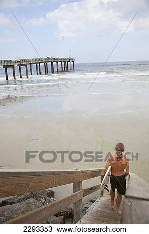 Usa, Florida, Surfer Walking Towards Sea; St Augustine View Large Photo Image Stock Image - Usa, Florida, Surfer Walking Towards Sea; St Augustine. Fotosearch