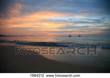 USA, Hawaii Islands, Big Island, Sailboats on quiet ocean at sunset; Kaunaoa Beach View Large Photo Image Stock Image - USA, Hawaii Islands, Big Island, Sailboats on quiet ocean at sunset; Kaunaoa Beach. Fotosearch
