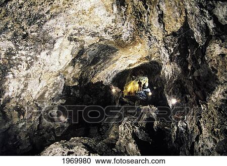 USA, Hawaii Islands, Long Exposure; Big Island, Hiker With Flashlight, View From Inside Lava Tube View Large Photo Image Stock Image - USA, Hawaii Islands, Long Exposure; Big Island, Hiker With Flashlight, View From Inside Lava Tube. Fotosearch