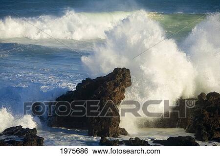 Stock Photograph - USA, Hawaii Islands, Maui, Big Winter Surf Crashing On Rocks; Ho'okipa. Fotosearch