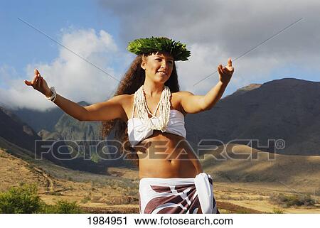 USA, Hawaii Islands, Maui, Mountains in background; West Maui, Beautiful Hawaiian girl dancing hula View Large Photo Image Stock Image - USA, Hawaii Islands, Maui, Mountains in background; West Maui, Beautiful Hawaiian girl dancing hula. Fotosearch