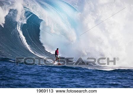 Stock Image - USA, Hawaii Islands, Maui, Surfer On Huge Wave; Peahi-Jaws. Fotosearch