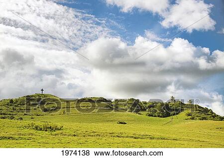 USA, Hawaii Islands, Maui, This Lava Rock Cross Was Erected In 1970 On Grassy Hill Overlooking Hana Town In Memory Of Paul Fagan Who Began Hana Ranch; Hana Coast View Large Photo Image Stock Photo - USA, Hawaii Islands, Maui, This Lava Rock Cross Was Erected In 1970 On Grassy Hill Overlooking Hana Town In Memory Of Paul Fagan Who Began Hana Ranch; Hana Coast. Fotosearch