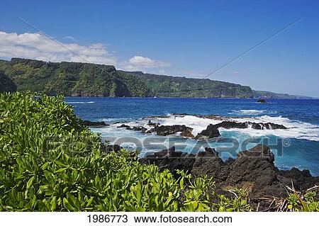 Stock Image - USA, Hawaii Islands, Maui, View of Northern Coast along road to Hana; Keanae Peninsula. Fotosearch