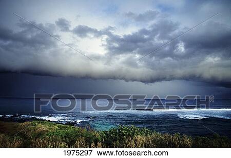 USA, Hawaii Islands, North Shore; Maui, Storm Front Clouds Overlooking Ocean From Hillside View Large Photo Image Stock Photo - USA, Hawaii Islands, North Shore; Maui, Storm Front Clouds Overlooking Ocean From Hillside. Fotosearch