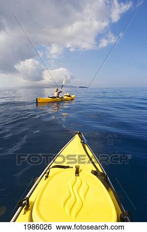 USA, Hawaii Islands, Woman in yellow kayak on calm ocean of southern coast taken from perspective of another kayak; Maui View Large Photo Image Stock Photograph - USA, Hawaii Islands, Woman in yellow kayak on calm ocean of southern coast taken from perspective of another kayak; Maui. Fotosearch