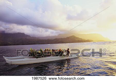 USA, Hawaii, Kauai, Couple riding in traditional double hull wedding canoe; Hanalei Bay View Large Photo Image Stock Photograph - USA, Hawaii, Kauai, Couple riding in traditional double hull wedding canoe; Hanalei Bay. Fotosearch