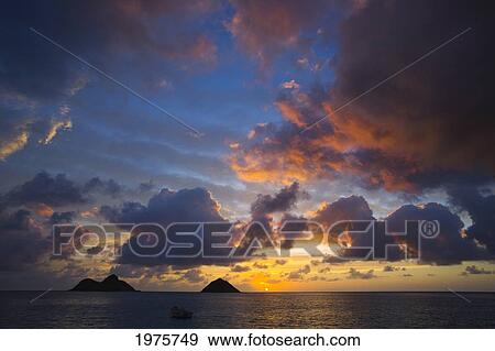 Stock Photo - USA, Hawaii, Lanikai, Clouds At Sunrise; Mokulua Islands. Fotosearch