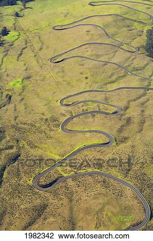 Stock Image - USA, Hawaii, Maui, Aerial view of serpentine switchbacks of Haleakala Highway; Kula. Fotosearch
