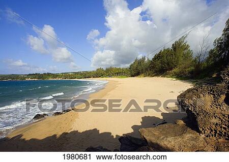 Stock Image - USA, Hawaii, Maui, View of empty Fleming Beach; Kapalua. Fotosearch