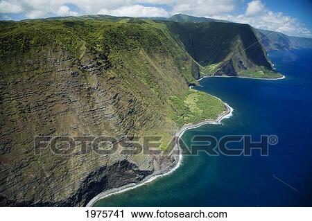Stock Image - USA, Hawaii, Molokai, Cliffs and sea; North Shore. Fotosearch