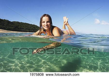 USA, Hawaii, Oahu, Beautiful Surfer Woman In The Ocean; Waikiki View Large Photo Image Stock Photo - USA, Hawaii, Oahu, Beautiful Surfer Woman In The Ocean; Waikiki. Fotosearch