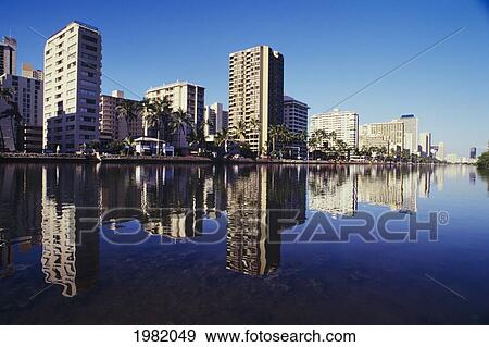 Stock Photo - USA, Hawaii, Oahu, Honolulu, View of condominiums from Ala Wai canal; Waikiki. Fotosearch