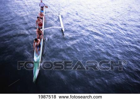 USA, Hawaii, Oahu, Men paddling outrigger canoe; Ala Wai Canal View Large Photo Image Stock Photo - USA, Hawaii, Oahu, Men paddling outrigger canoe; Ala Wai Canal. Fotosearch