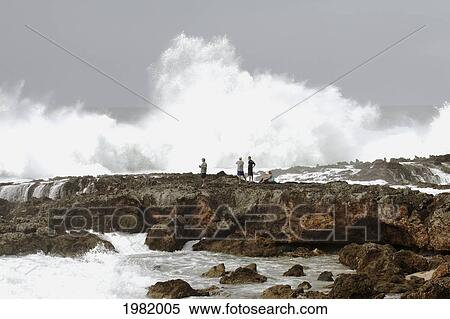 USA, Hawaii, Oahu, people watching; North Shore, Wave crashing against shore of Pacific ocean View Large Photo Image Stock Photography - USA, Hawaii, Oahu, people watching; North Shore, Wave crashing against shore of Pacific ocean. Fotosearch