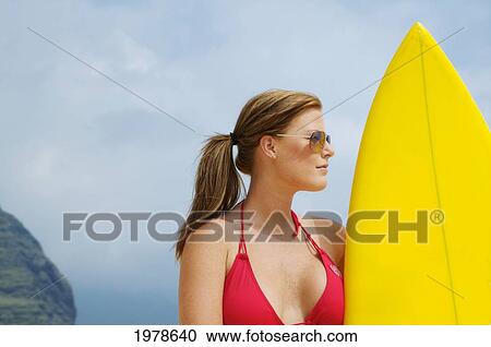 USA, Hawaii, Oahu, Woman on beach with yellow surfboard; Honolulu View Large Photo Image Stock Image - USA, Hawaii, Oahu, Woman on beach with yellow surfboard; Honolulu. Fotosearch
