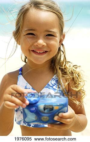 USA, Hawaii, Portrait of Little Girl Holding Cameraon beach; Oahu View Large Photo Image Stock Photography - USA, Hawaii, Portrait of Little Girl Holding Cameraon beach; Oahu. Fotosearch