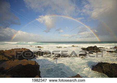 Stock Photo - USA, Hawaii, Rainbow offshore of Hookipa Beach; Maui. Fotosearch