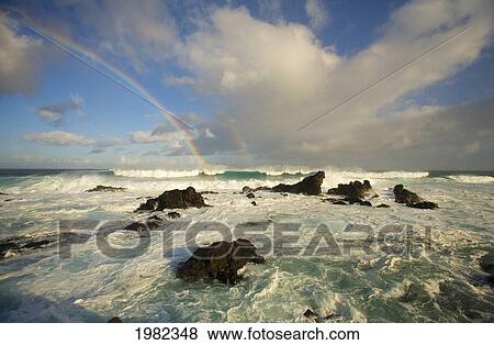 Stock Photo - USA, Hawaii, Rainbow offshore of Hookipa Beach; Maui. Fotosearch
