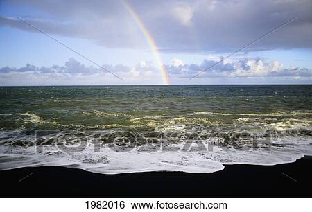USA, Hawaii, Rainbow over Pacific Ocean and black sand beach in Hawaii Volcanoes National Park; Big Island View Large Photo Image Stock Photograph - USA, Hawaii, Rainbow over Pacific Ocean and black sand beach in Hawaii Volcanoes National Park; Big Island. Fotosearch