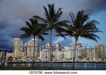 Stock Photograph - USA, Hawaii, USA, Hawaii, Oahu, Evening View of City From Magic Island; Waikiki. Fotosearch