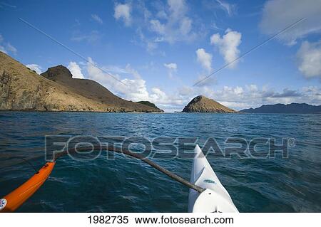 USA, Hawaii, View of Mokulua Islands and bow of canoe; Oahu View Large Photo Image Stock Photography - USA, Hawaii, View of Mokulua Islands and bow of canoe; Oahu. Fotosearch