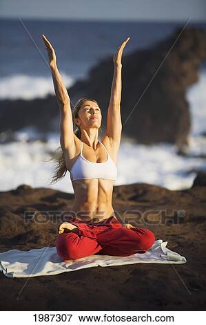 USA, Hawaii, Young woman doing yoga near Pacific Ocean; Maui View Large Photo Image Stock Photo - USA, Hawaii, Young woman doing yoga near Pacific Ocean; Maui. Fotosearch