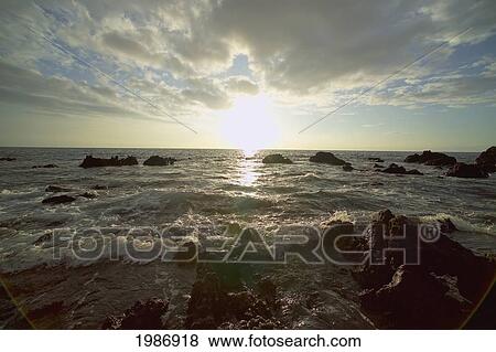 USA, Hawaiian Islands, Big Island, Sunset and surf on rocks; Kohala Coast View Large Photo Image Stock Photo - USA, Hawaiian Islands, Big Island, Sunset and surf on rocks; Kohala Coast. Fotosearch