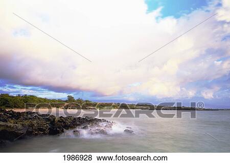 USA, Hawaiian Islands, Big Island, South Kohala, Cloudy sky and water washing onto rocks; Hapuna Beach View Large Photo Image Stock Photo - USA, Hawaiian Islands, Big Island, South Kohala, Cloudy sky and water washing onto rocks; Hapuna Beach. Fotosearch