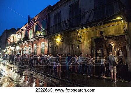 Stock Image - USA, Louisiana, French Quarter; New Orleans, People in line to traditional club. Fotosearch
