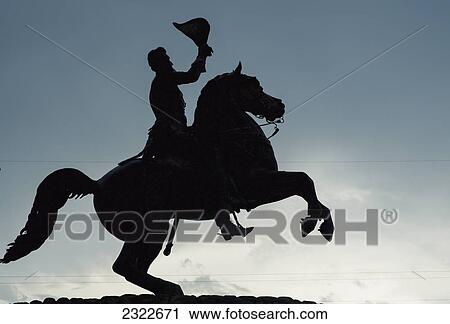 Stock Image - USA, Louisiana, French Quarter; New Orleans, Silhouette of equestrian statue. Fotosearch