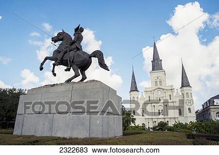 Stock Image - USA, Louisiana, French Quarter; New Orleans, View of statue of Andrew Jackson in front of Saint Louis Cathedral. Fotosearch
