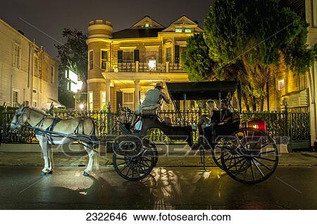 USA, Louisiana, French Quarter; New Orleans, Tourist travelling with horse carriage View Large Photo Image Stock Photograph - USA, Louisiana, French Quarter; New Orleans, Tourist travelling with horse carriage. Fotosearch