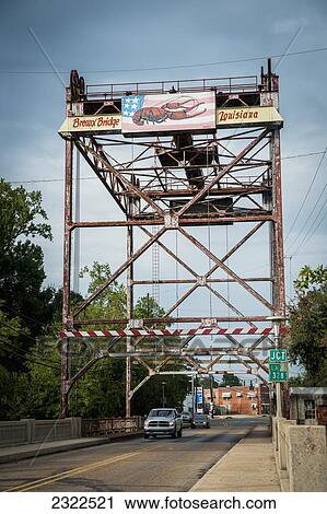 Stock Image - USA, Louisiana, Lobster sign over road; Breaux Bridge. Fotosearch