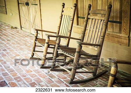 Stock Image - USA, Louisiana, Rocking chairs in Oakley Plantation; Audubon State. Fotosearch
