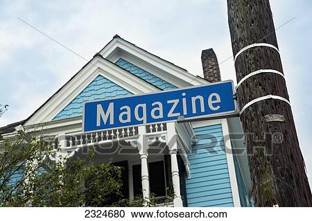 Stock Image - USA, Louisiana, Upward view of house and sign on Garden District; New Orleans. Fotosearch