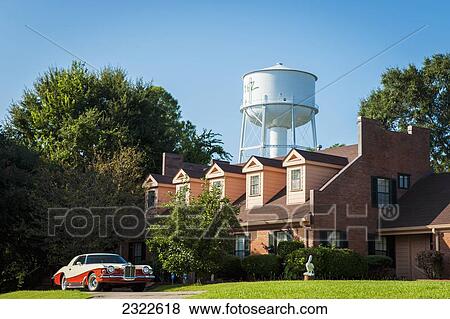 Stock Photo - USA, Mississippi, Natchez Water Tower and antique car; Natchez. Fotosearch