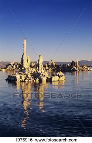 Stock Photograph - USA, Mono Lake Tufa State Reserve; California, Tufa Formations Reflecting On Lake. Fotosearch