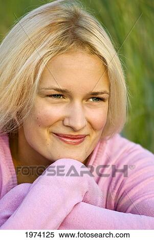 Stock Photography - Usa, New Jersey Oceancity, Headshot Portrait Of Blonde Haired Woman With Dune Grass In Backround.. Fotosearch