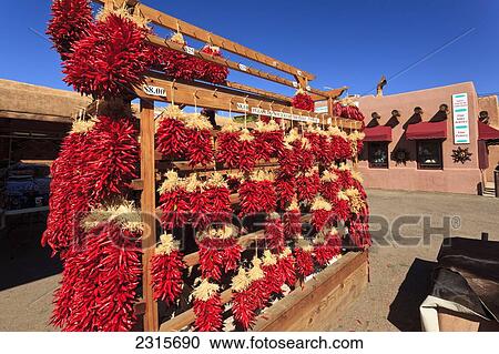 Stock Image - USA, New Mexico, Santa Fe, Red Chili Restras hanging outside souvenir store. Fotosearch