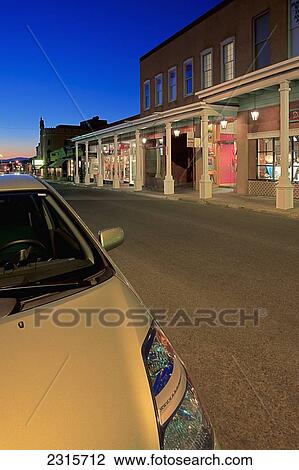Stock Image - USA, New Mexico, Santa Fe, View along West San Francisco Street at dusk in downtown. Fotosearch