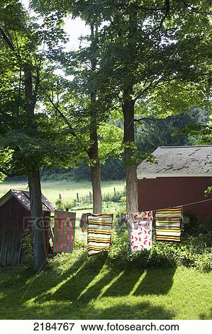 Stock Photo - Usa, New York State, Colorful Towels Drying In Sun On Clothes Line; Hudson Valley. Fotosearch