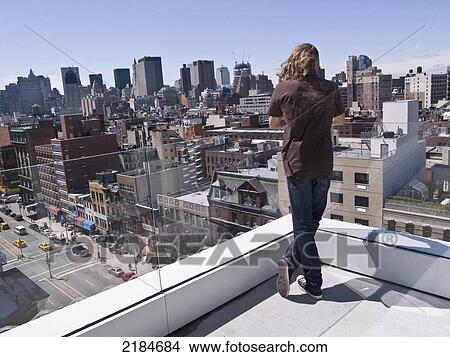 Usa, New York State, Man On Rooftop Of New Museum; New York City View Large Photo Image Picture - Usa, New York State, Man On Rooftop Of New Museum; New York City. Fotosearch