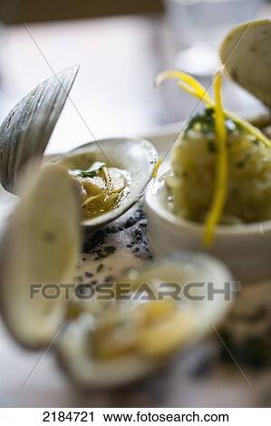 Stock Image - Usa, New York State, New York City, Brooklyn, Close-Up Of Large Clams At Le Gamin Restaurant; Prospect Heights. Fotosearch