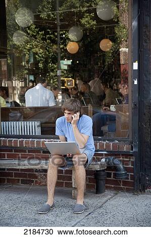 Usa, New York State, New York City, Brooklyn, Man With Laptop Outside Cafe; Williamsburg View Large Photo Image Stock Image - Usa, New York State, New York City, Brooklyn, Man With Laptop Outside Cafe; Williamsburg. Fotosearch