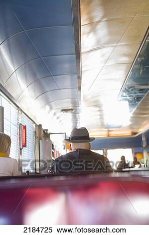 Stock Photography - Usa, New York State, New York City, Brooklyn, Men Eating Cheeseburgers At Relish Diner; Williamsburg. Fotosearch