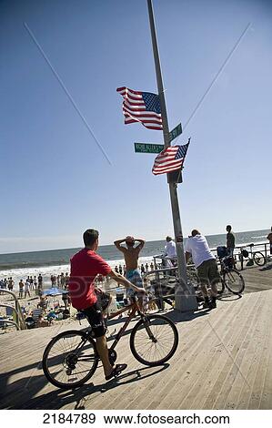 Usa, New York State, People And Cyclist On Boardwalk; Rockaway View Large Photo Image Stock Photo - Usa, New York State, People And Cyclist On Boardwalk; Rockaway. Fotosearch