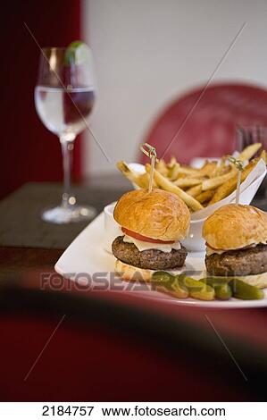 Stock Photo - Usa, New York State, Plate Of Fries And Hamburgers In Cinema Restaurant; New York City. Fotosearch